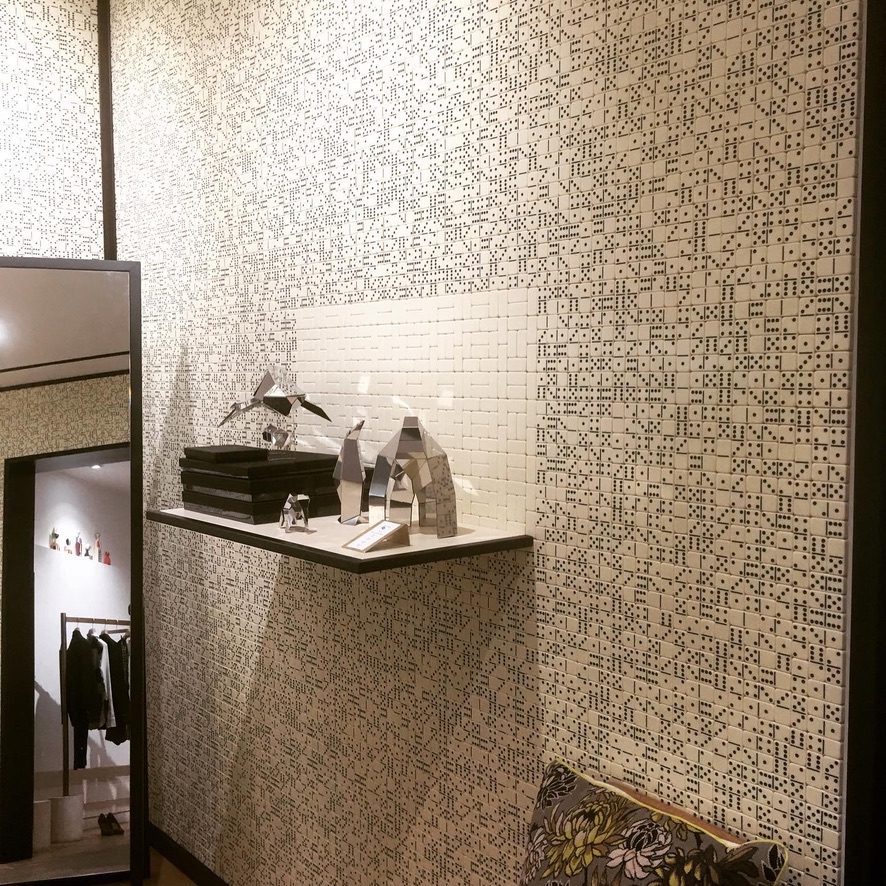 Specialised dice and domino pattern mosaic feature wall with display shelf