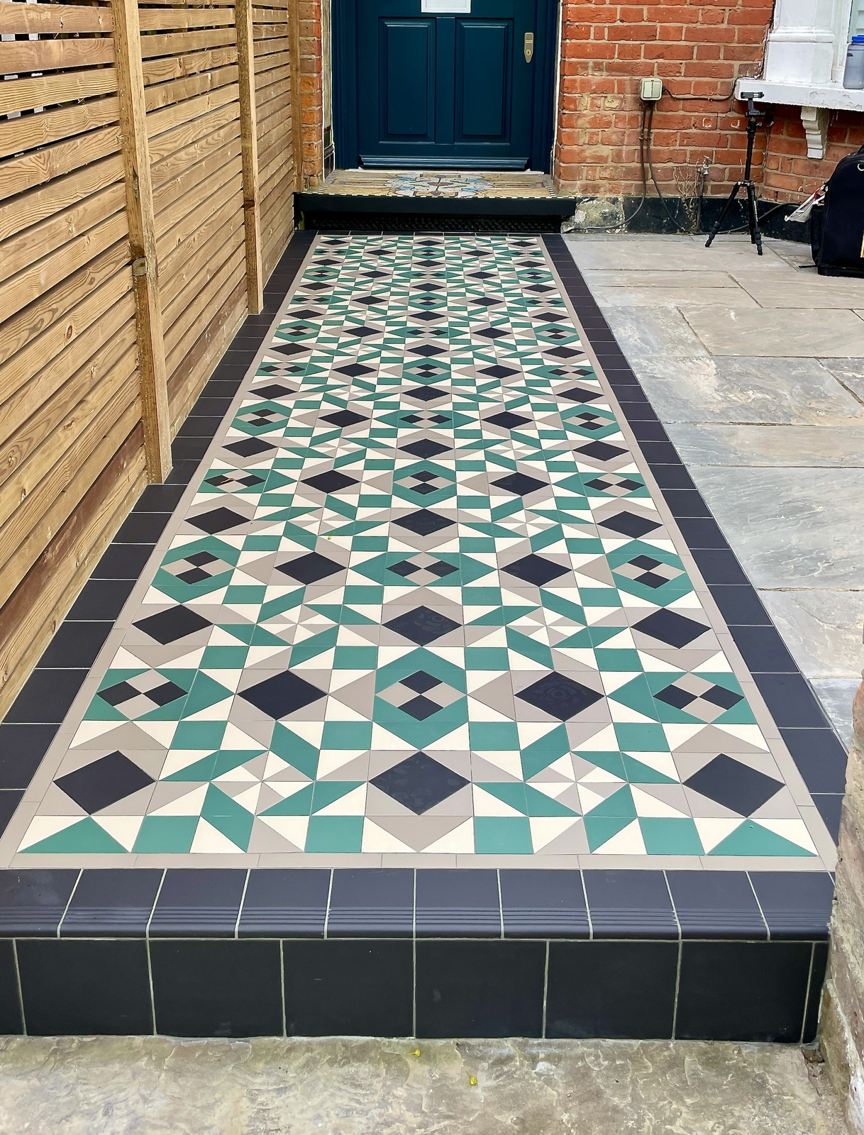 Teal, black and cream Victorian tiled garden path