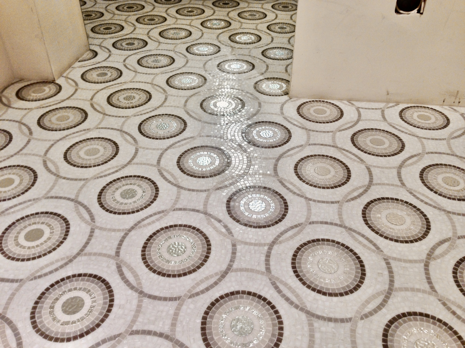 Circular mosaic pattern tiled floor