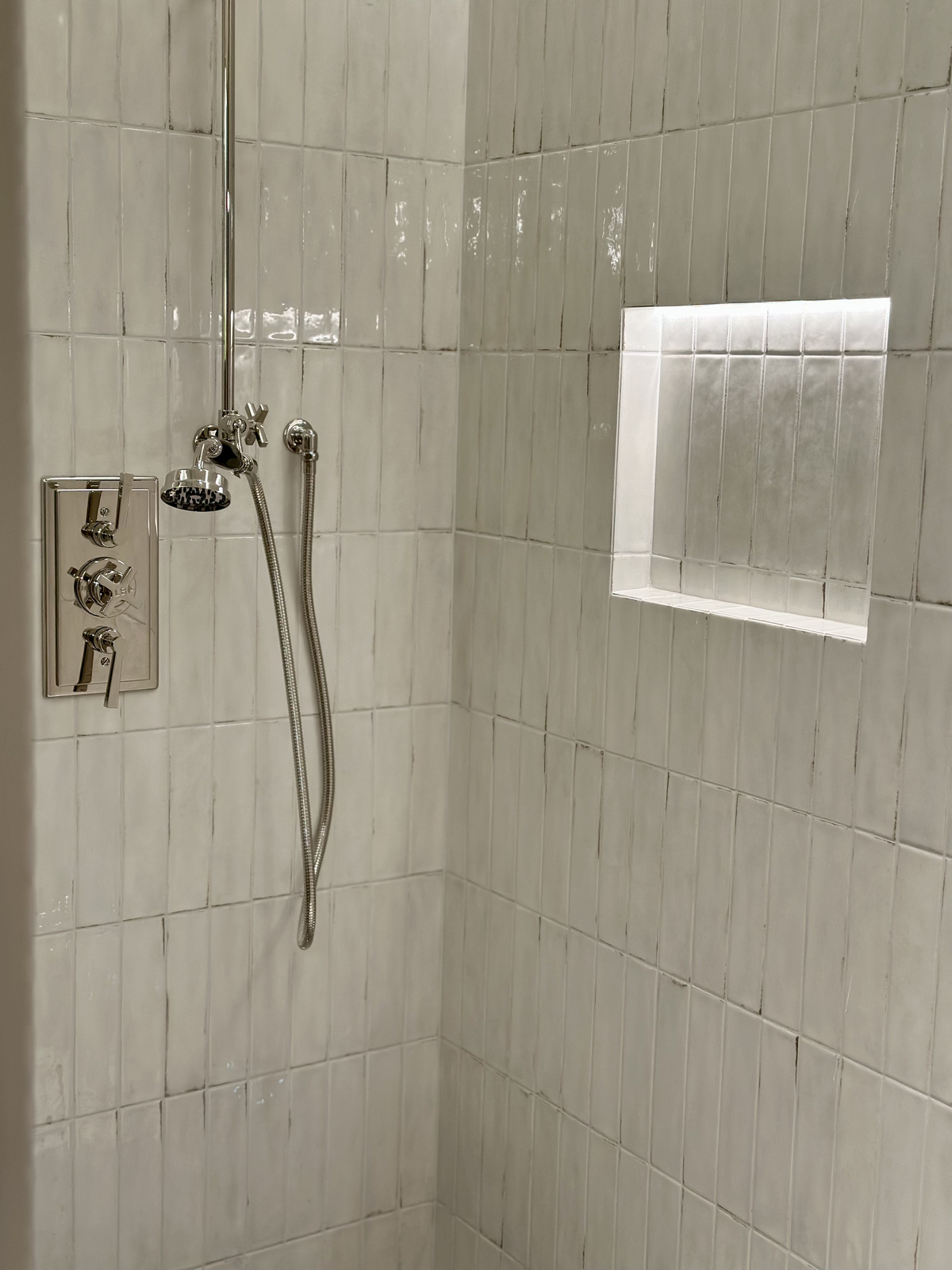 Shower with light cream rustic tiles